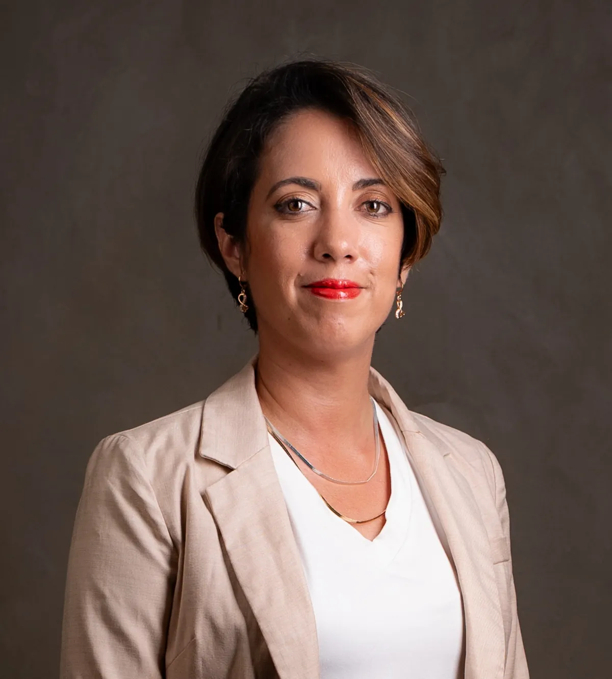 Professional headshot of Martine Drouin wearing a light business jacket