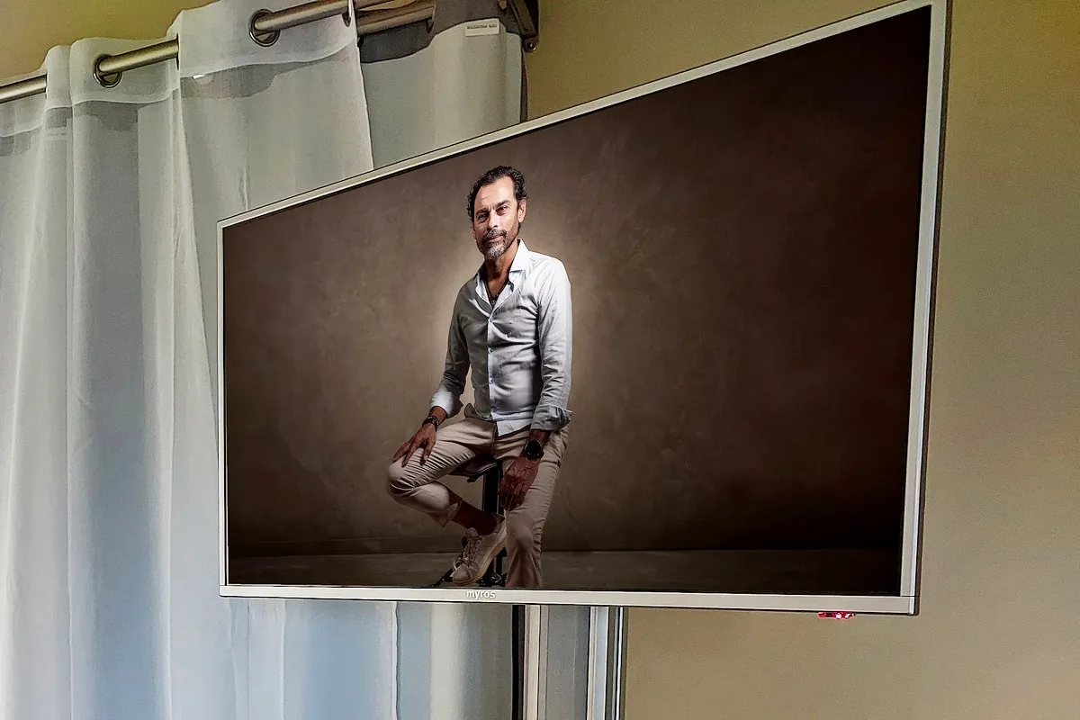 Portrait displayed on screen for review during a studio photography session
