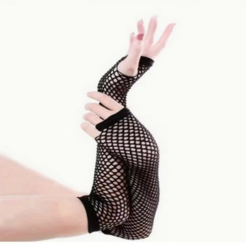 Black fishnet arm warmers worn during a studio photoshoot.