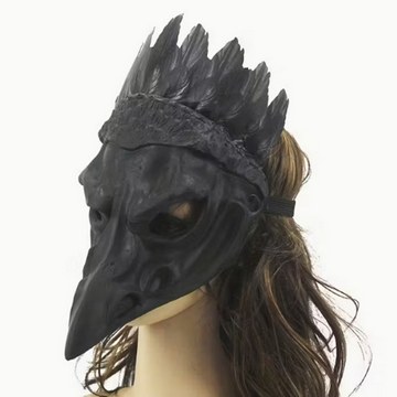 Black raven-inspired mask with feather details, used as a creative studio photoshoot accessory.